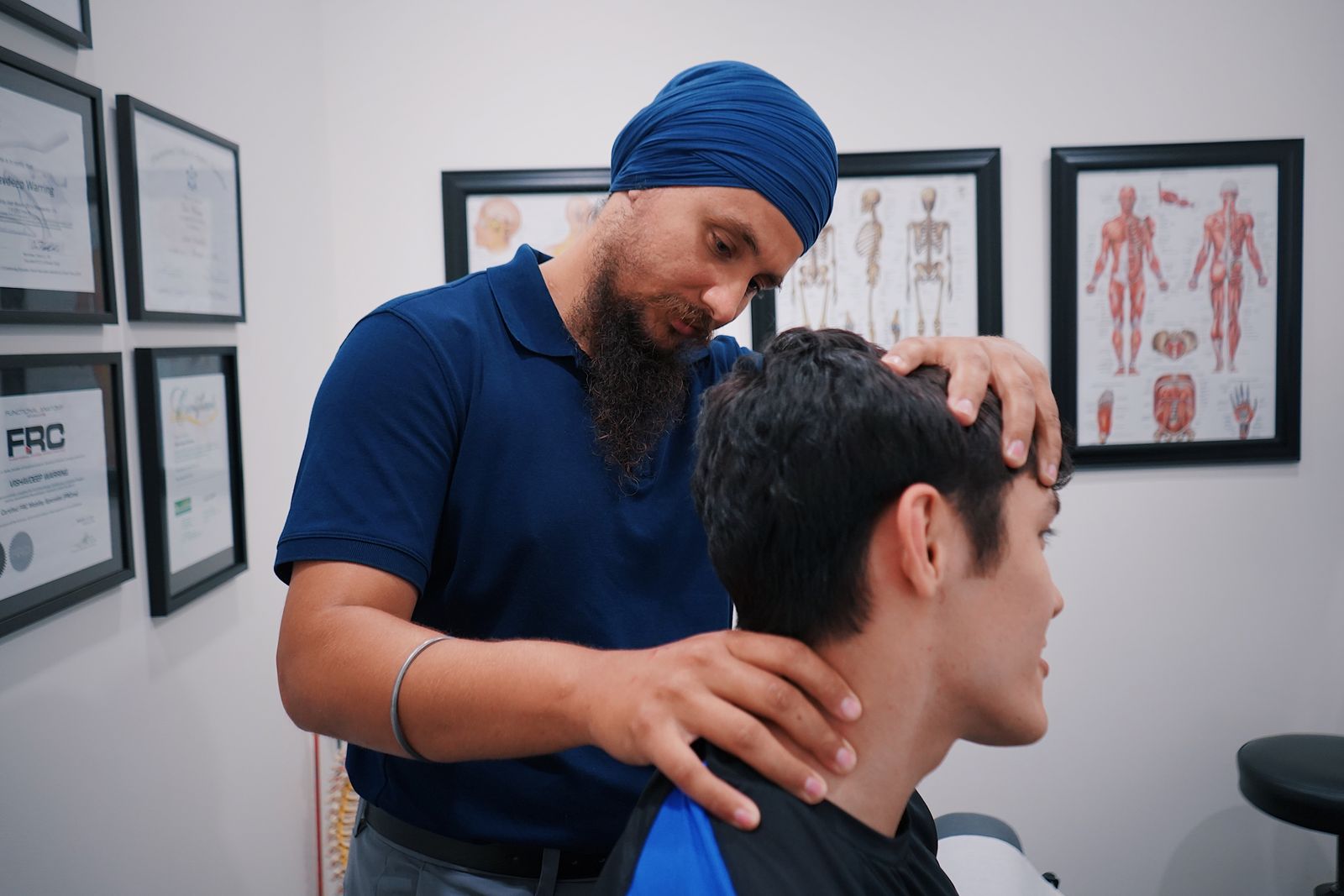 Indian clinician providing careful chiropractic care